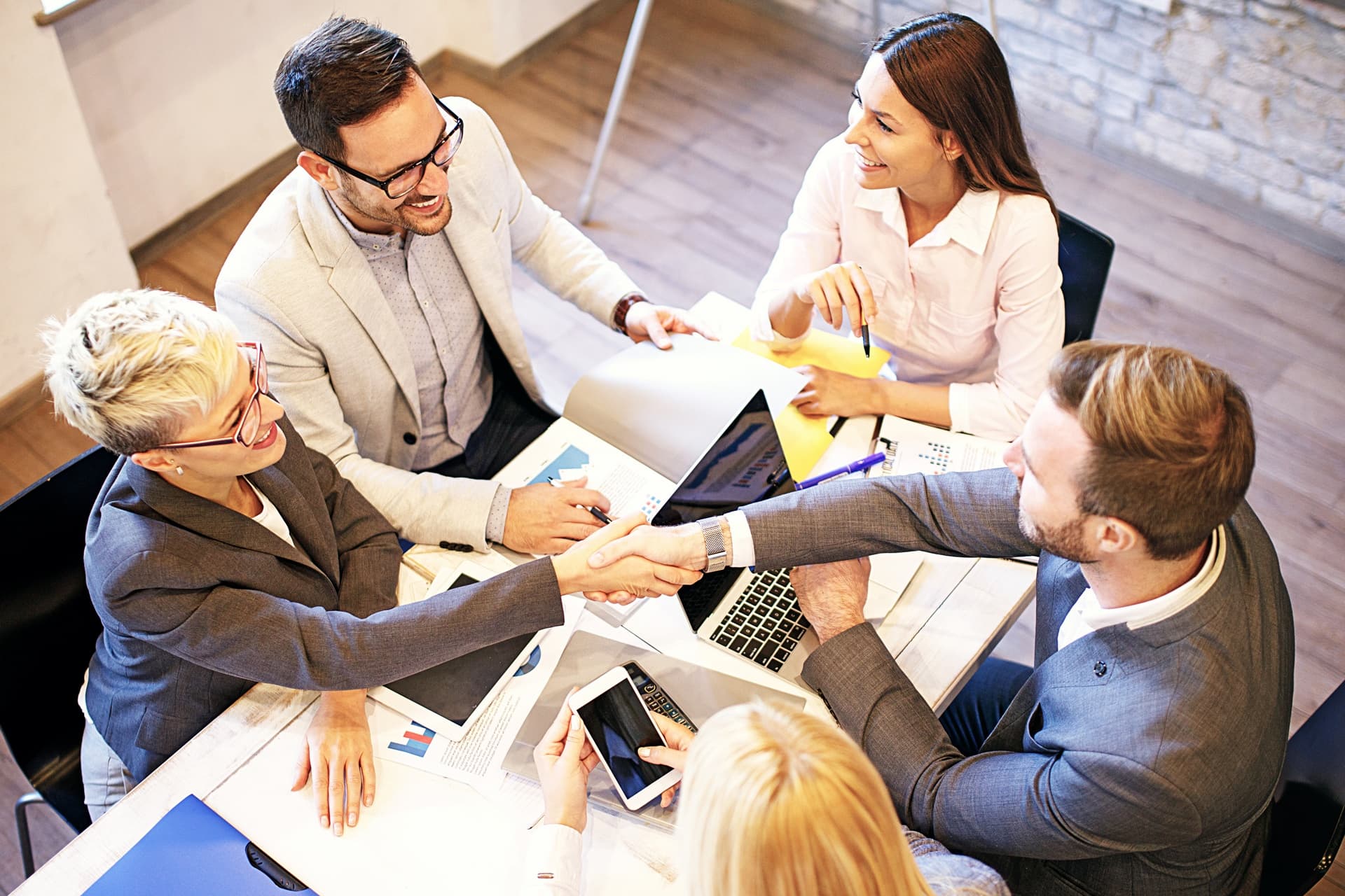 A leadership team meeting around a conference table